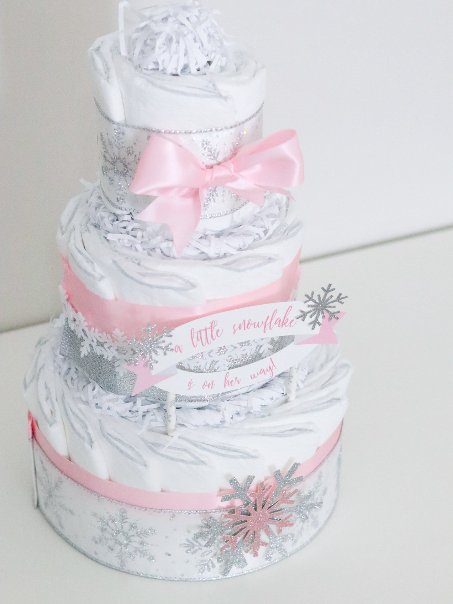 pink snowflake diaper cake