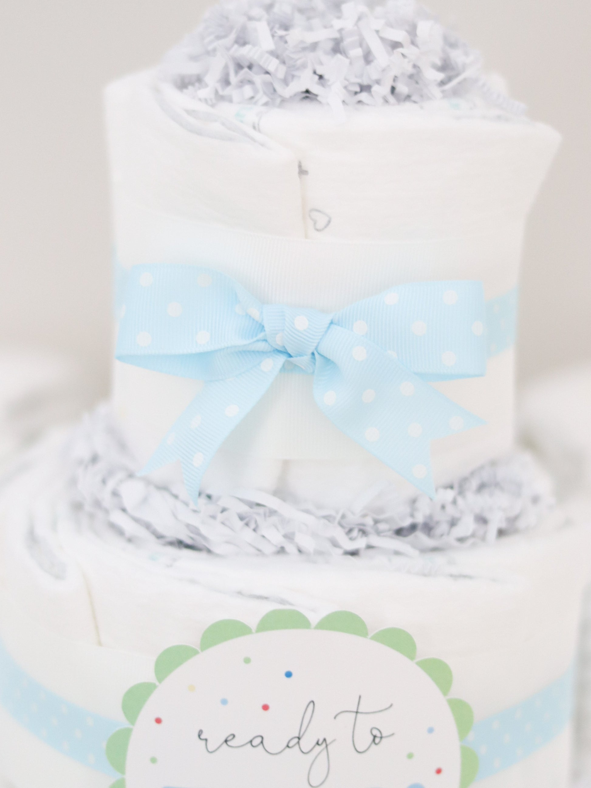 blue polka dot diaper cake bow