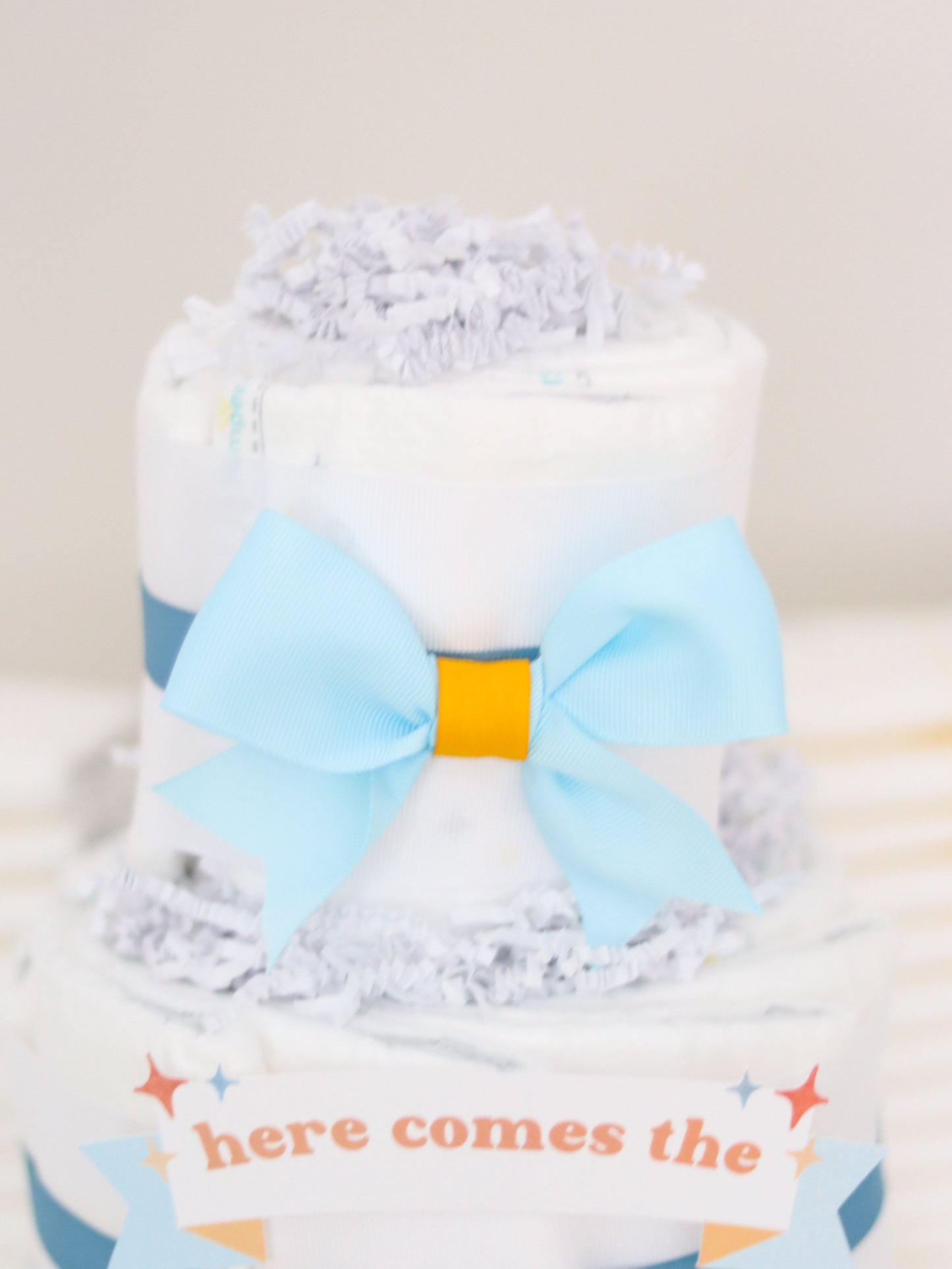 here comes the son diaper cake bow