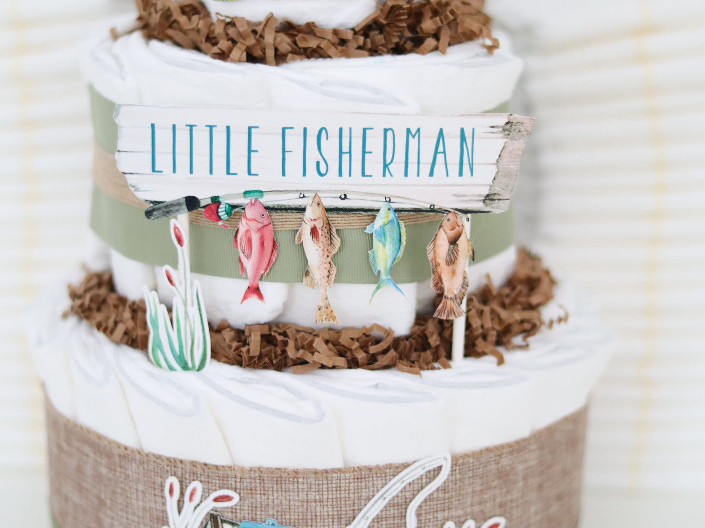 little fisherman diaper cake sign with fishing pole and fish