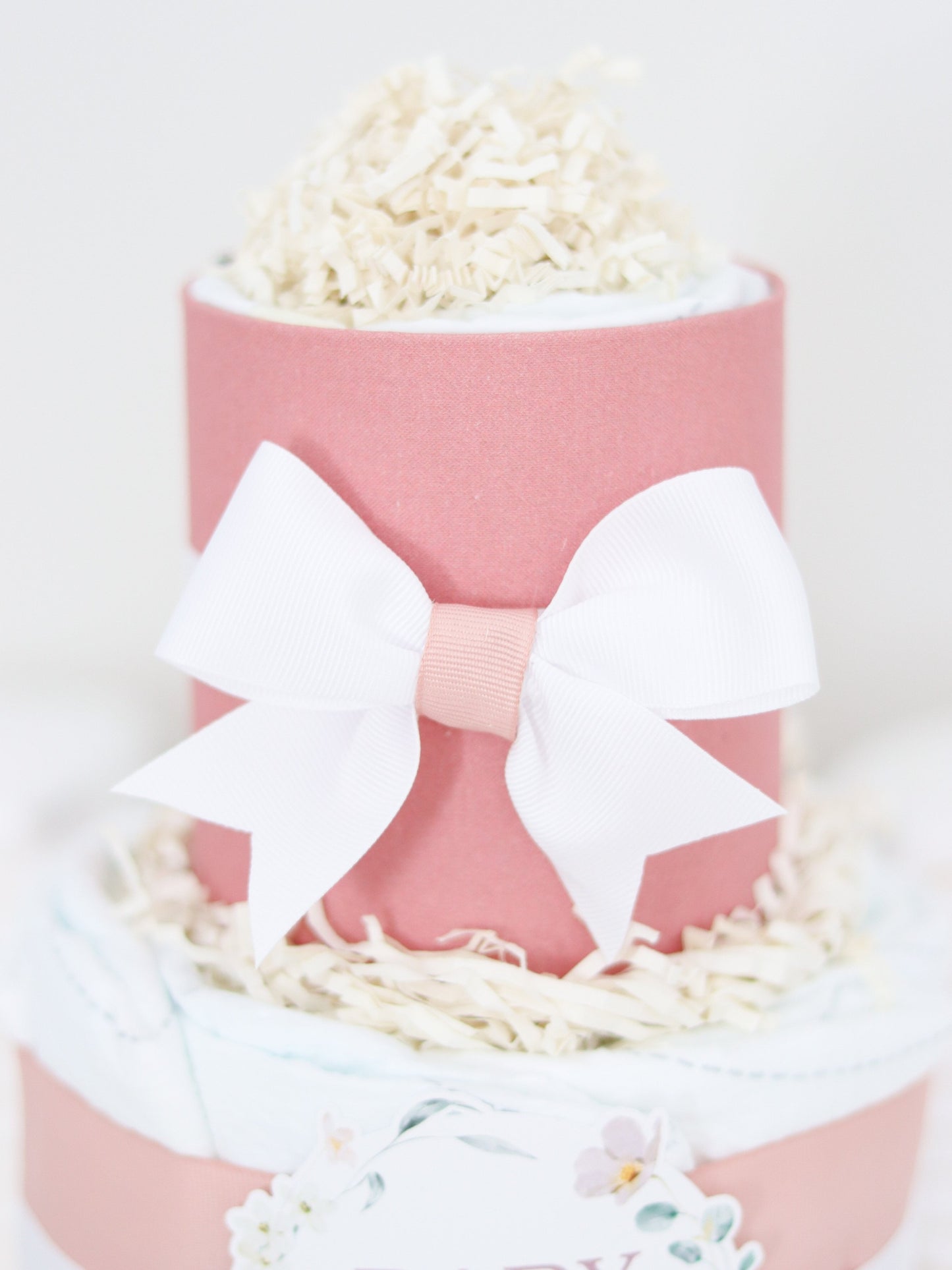 baby in bloom white diaper cake bow