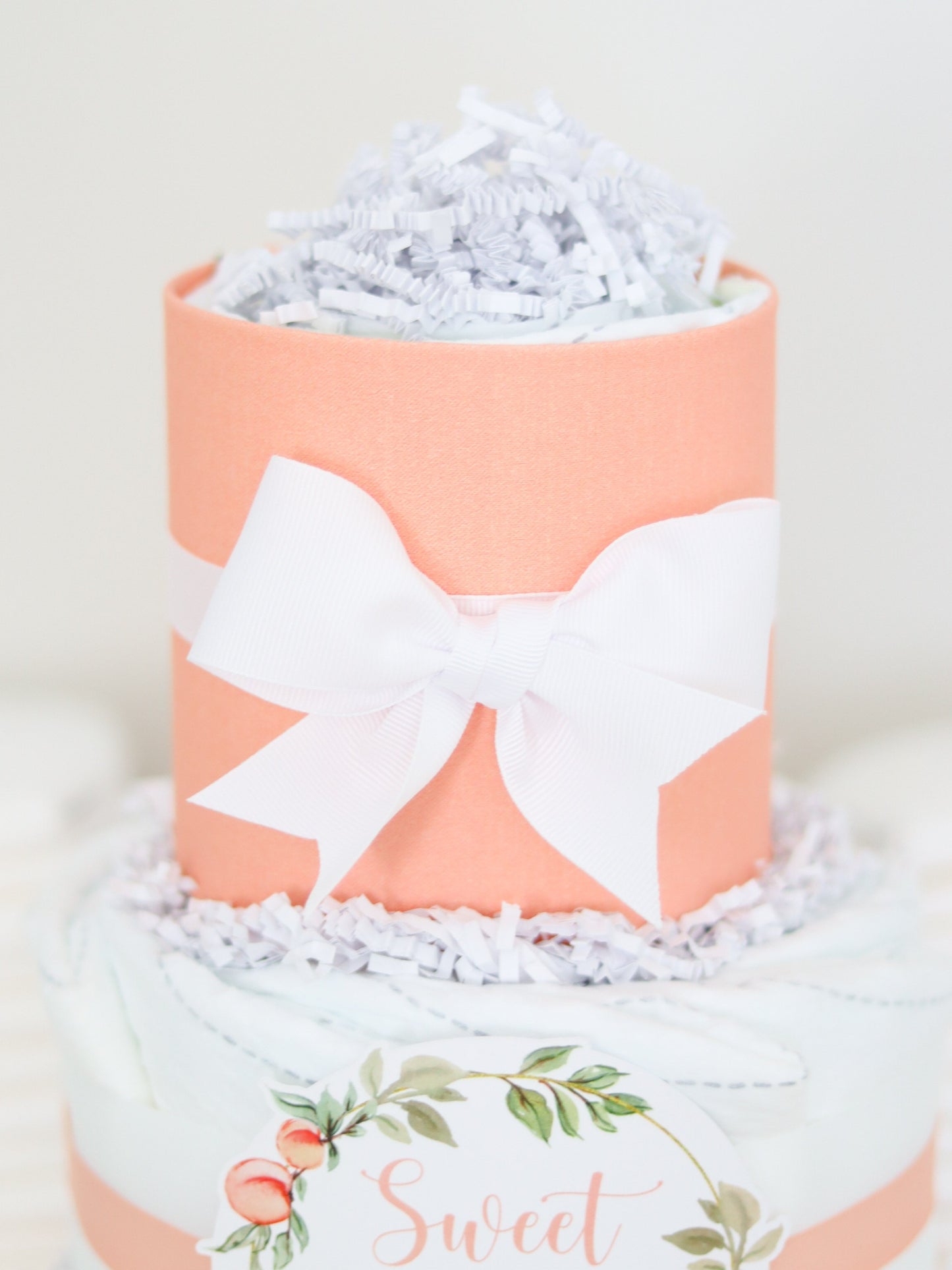 peach diaper cake white bow