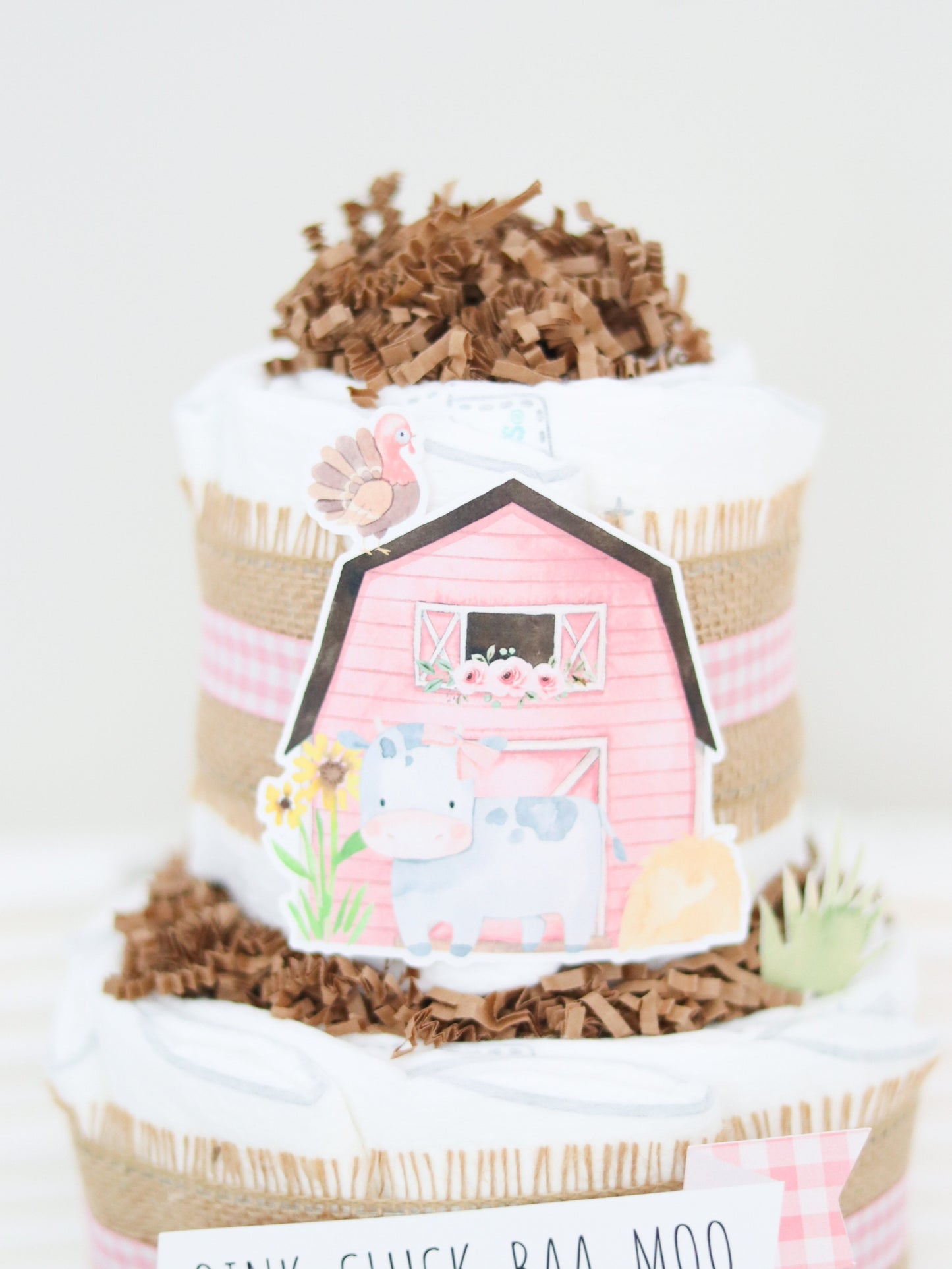 pink barn diaper cake decoration with cow turkey hay flowers sunflowers