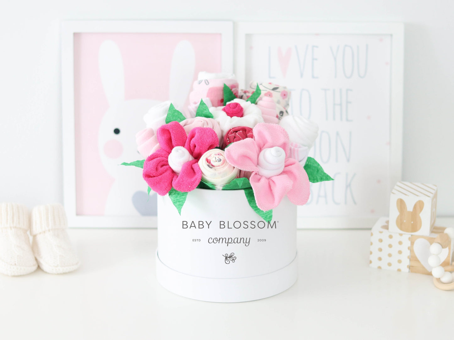 Pink baby girl gift basket baby blossom logo