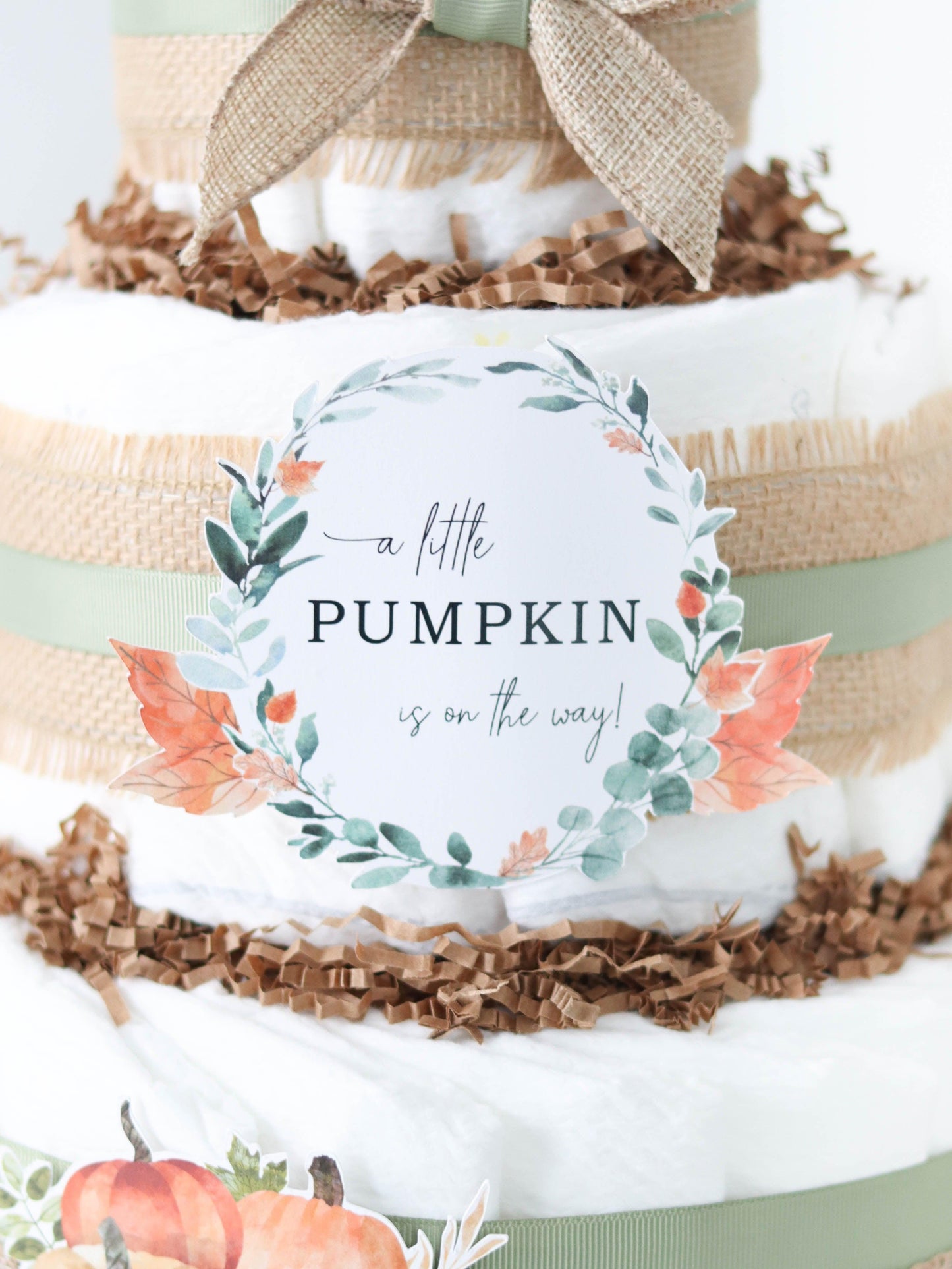 a little pumpkin is on the way diaper cake sign