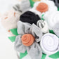 neutral baby gift washcloth flowers
