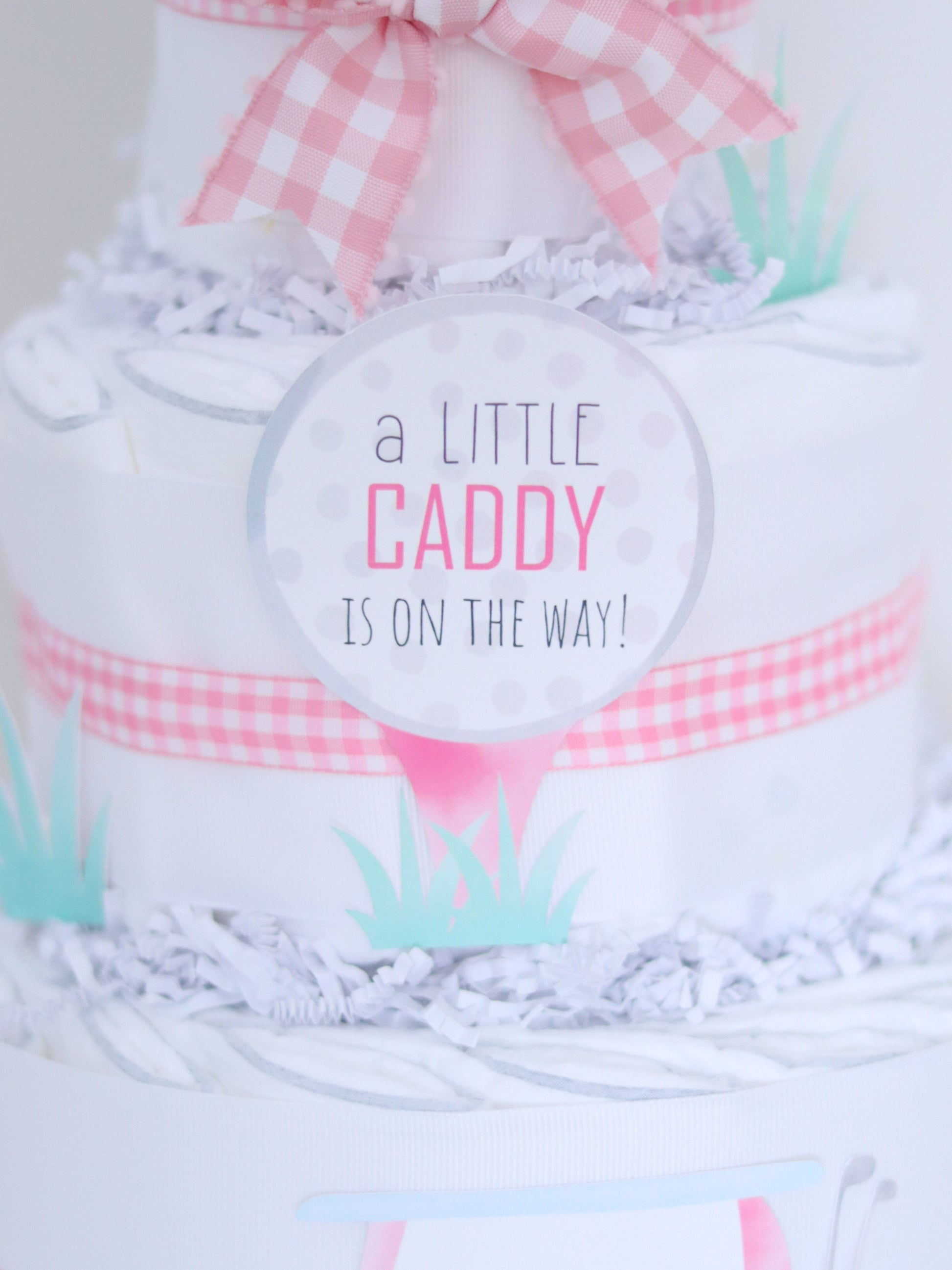 a little caddy is on the way diaper cake sign