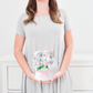 petite baby clothing gift bouquet holding