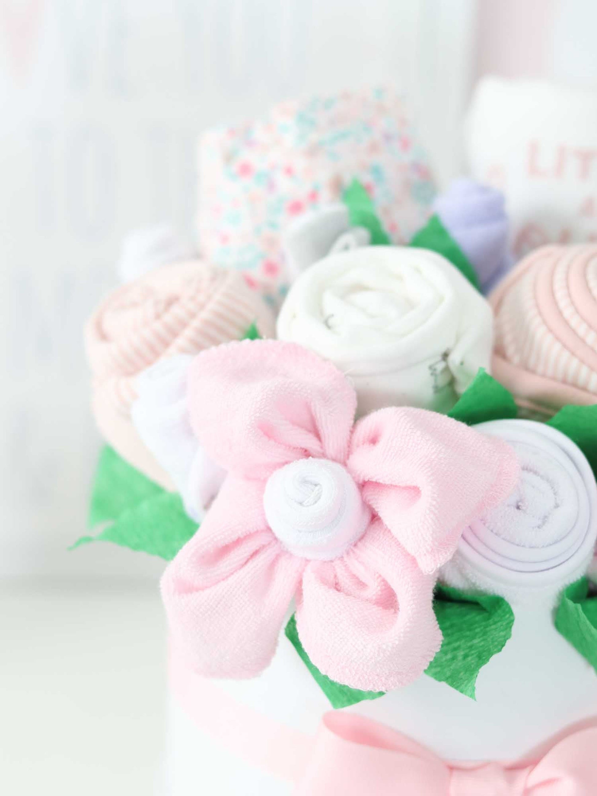 pink and white washcloth and sock flowers